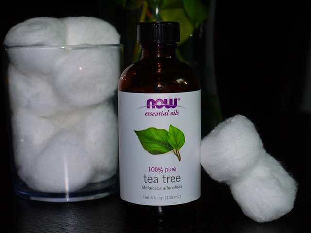 NOW Pure Tea Tree Essential Oil applied with cotton balls